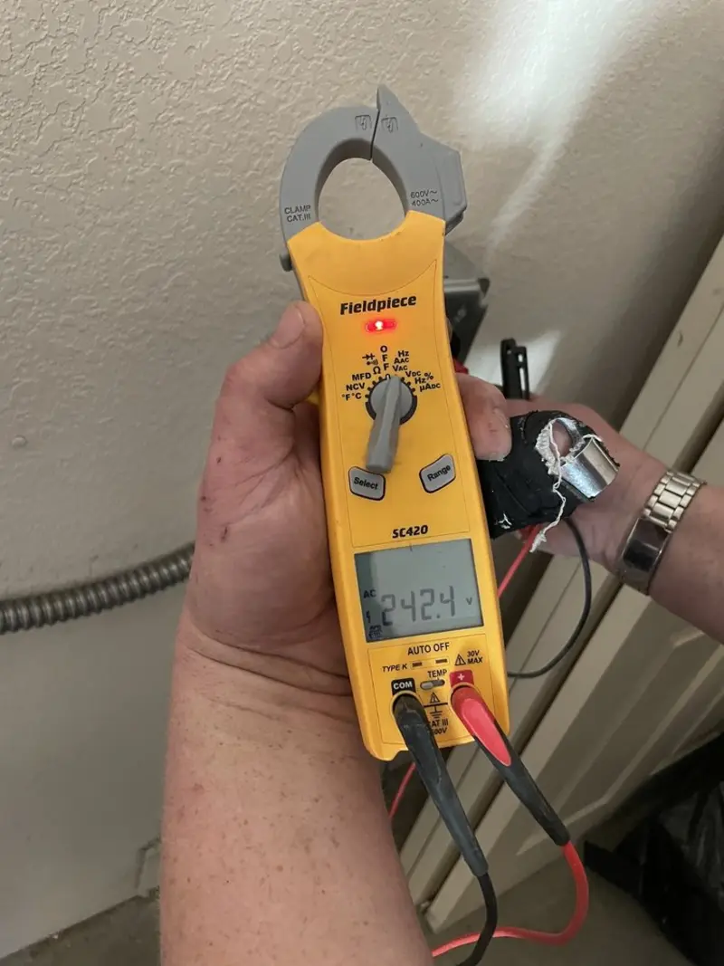 Voltage testing with clamp meter during Ceiling Fan Installation in New Milford